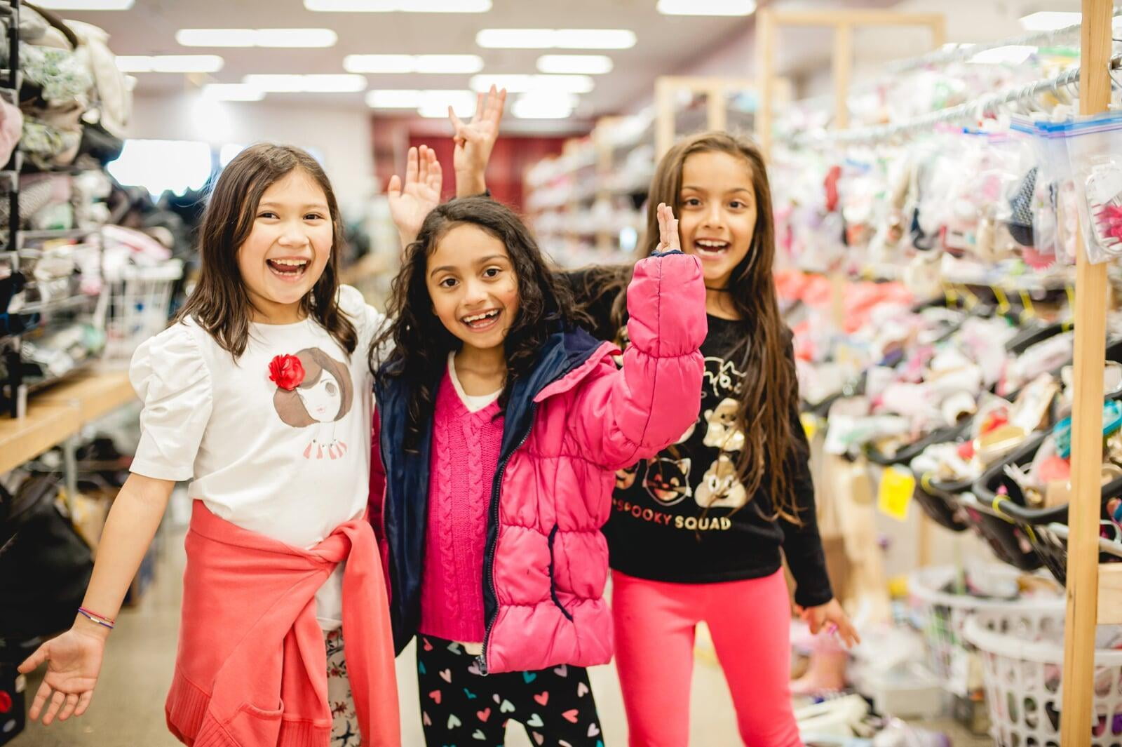 3 little girls shopping